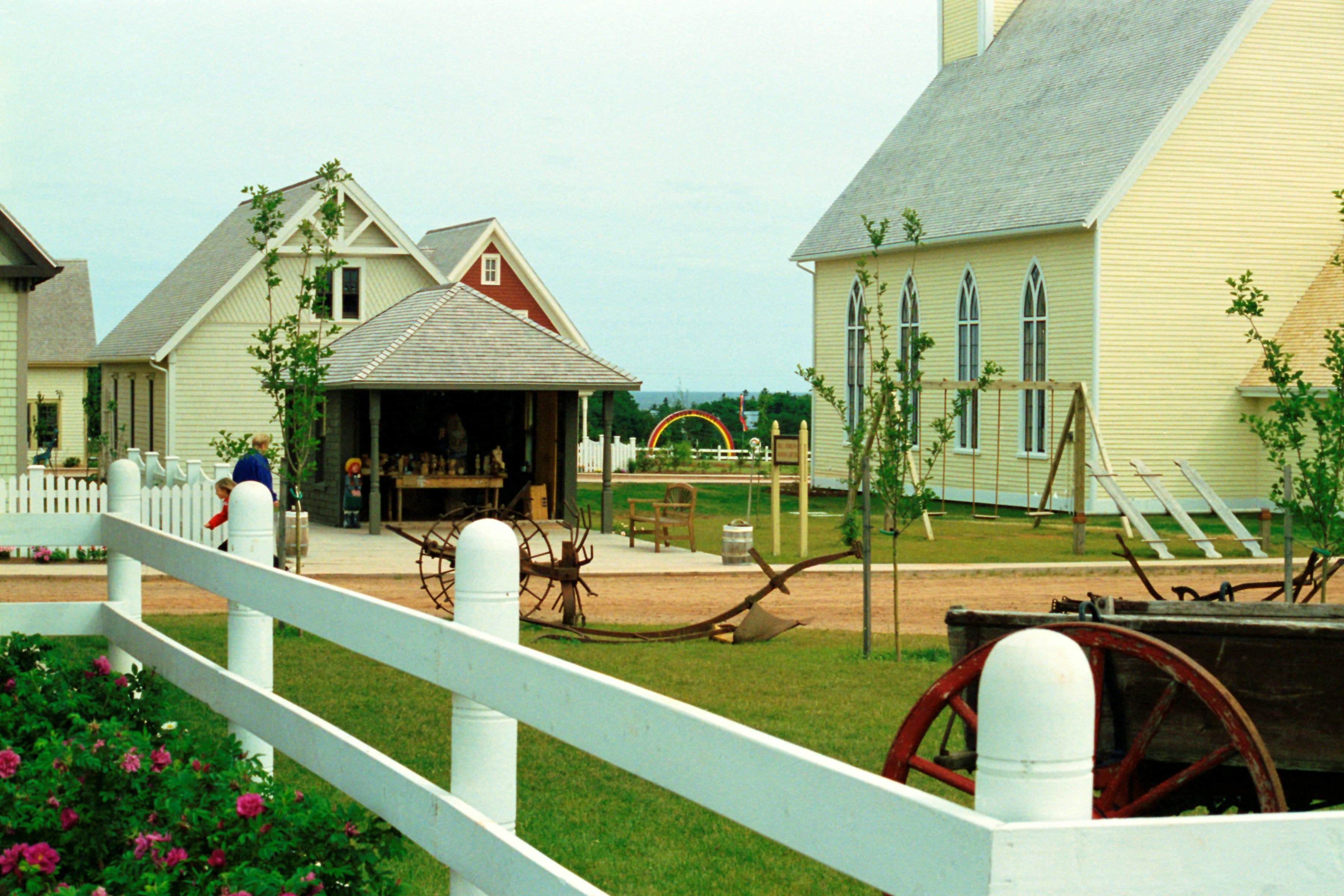 Farm community with houses and farm equipment